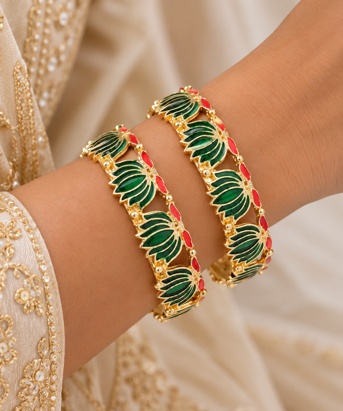 Ornate Gold Bangles with Green and Red Accents